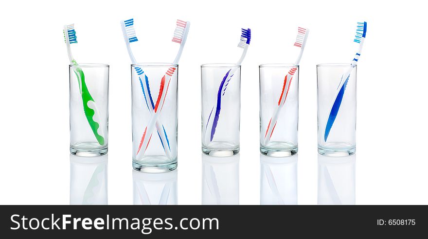 New toothbrushes in glasses, isolated. New toothbrushes in glasses, isolated