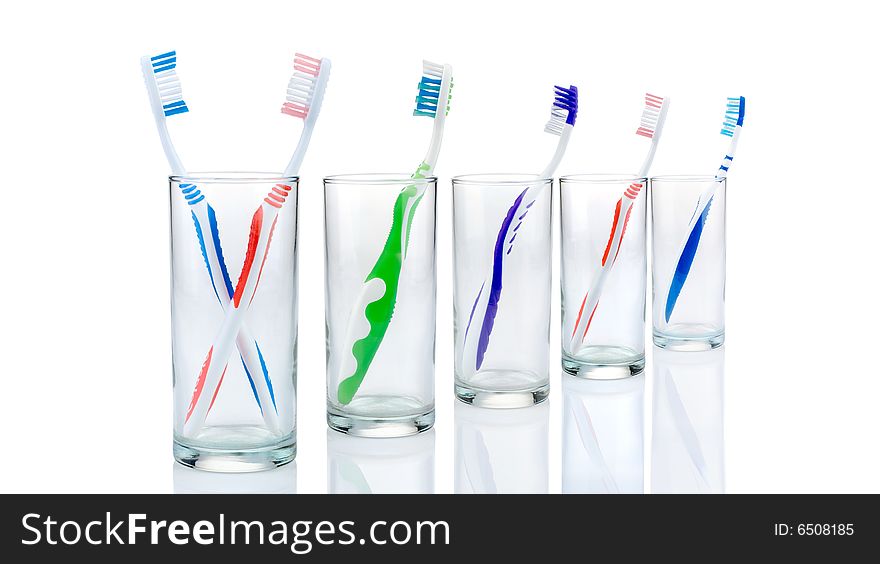 New toothbrushes in glasses, isolated
