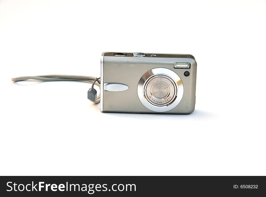 Shot of a silver camera on white