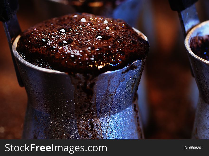 Hot turkish coffee in the jezve. Narrow depth of field. Hot turkish coffee in the jezve. Narrow depth of field.