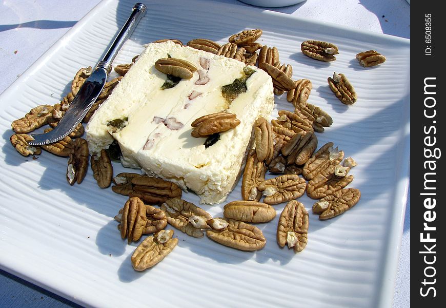 Gourmet cheese and nuts with knife