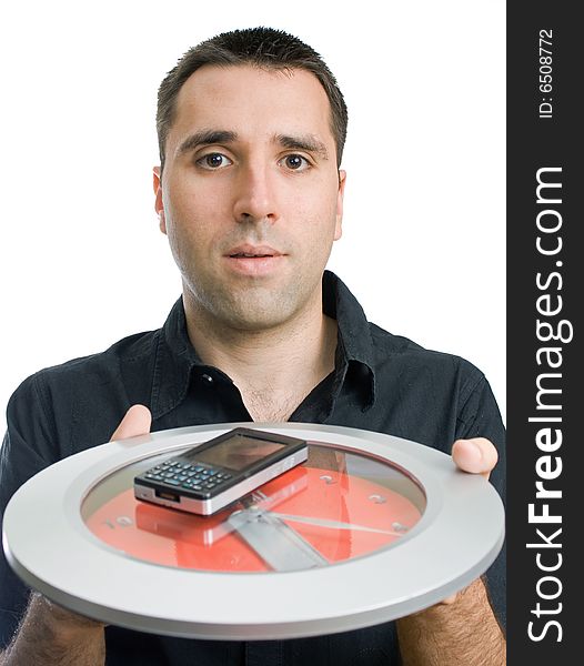 Young man, holding a cellphone on a clock, reaching forward. Young man, holding a cellphone on a clock, reaching forward