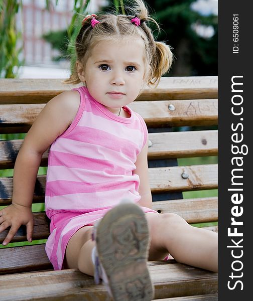 Little girl on the bench