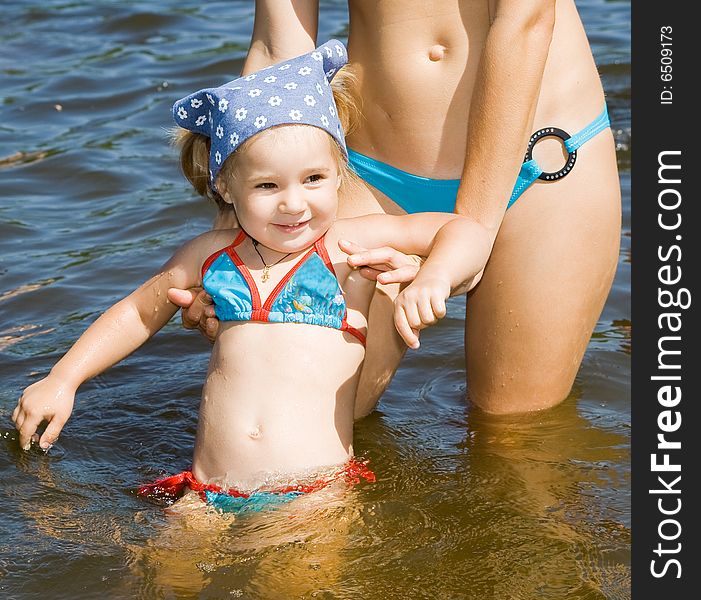 Little girl bathe in river