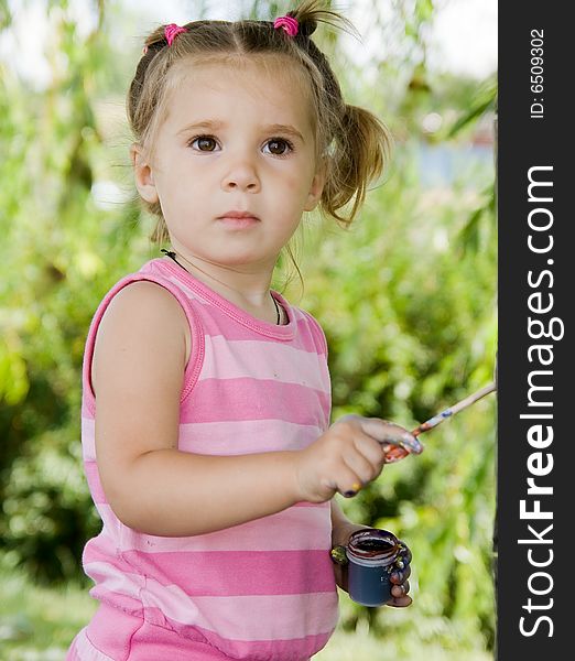 Portrait of little girl playing outdoor