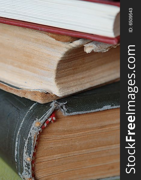 Big pile of old books. Close-up. Narrow depth of field.