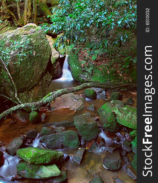 A small stream with falling water in the Blue Mountains, Australia. A small stream with falling water in the Blue Mountains, Australia