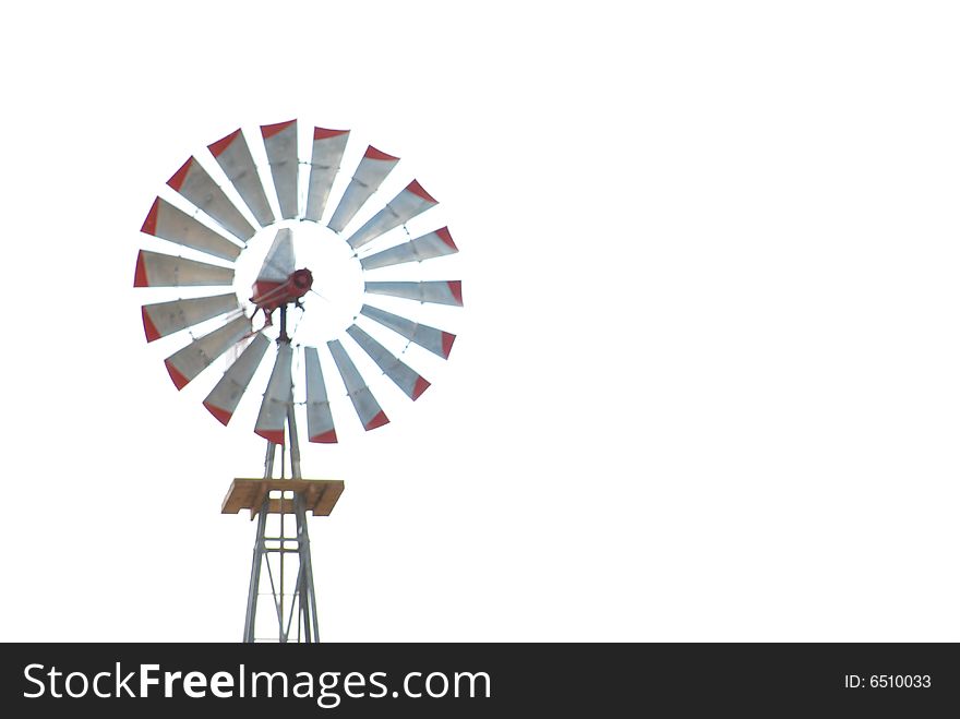 A windmill against a white sky