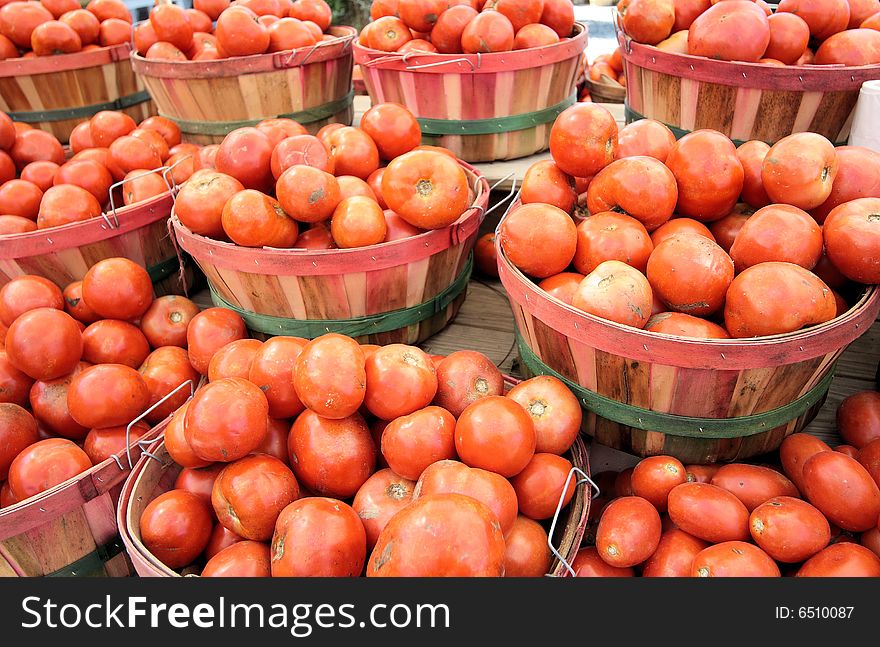 Tomatoes in baskets at the farm stand