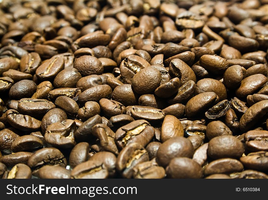 A large heap of coffee is in grains