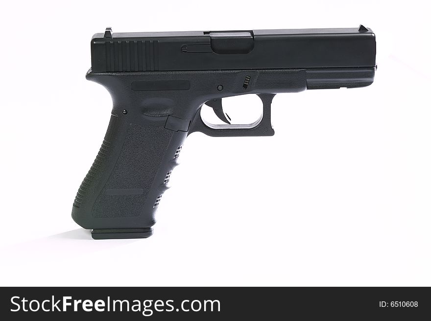 Handgun isolated on a white background. Handgun isolated on a white background.