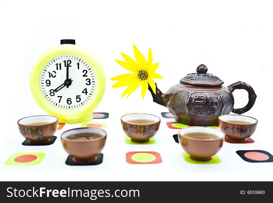 Clay teapots and cups isolated on a white background