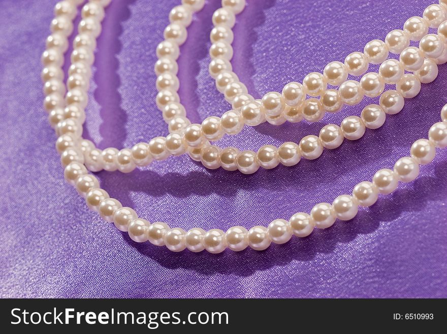 Beads of pearl on the lilac for lady