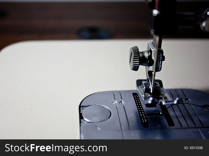 A close-up image of a sewing machine\\\'s needle. A close-up image of a sewing machine\\\'s needle.