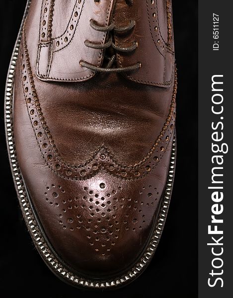 Brown Leather Shoe on Black Background