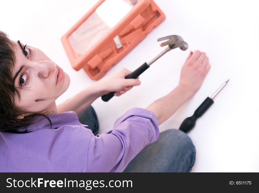 Portrait of a young beautiful woman holding tools. Portrait of a young beautiful woman holding tools