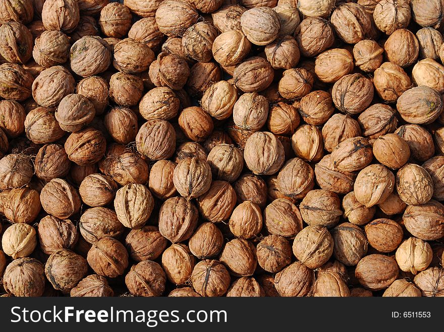 a lot of walnuts drying in the sun
