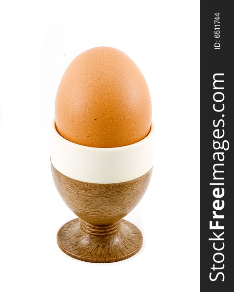 A brown soft boiled egg in the eggcup