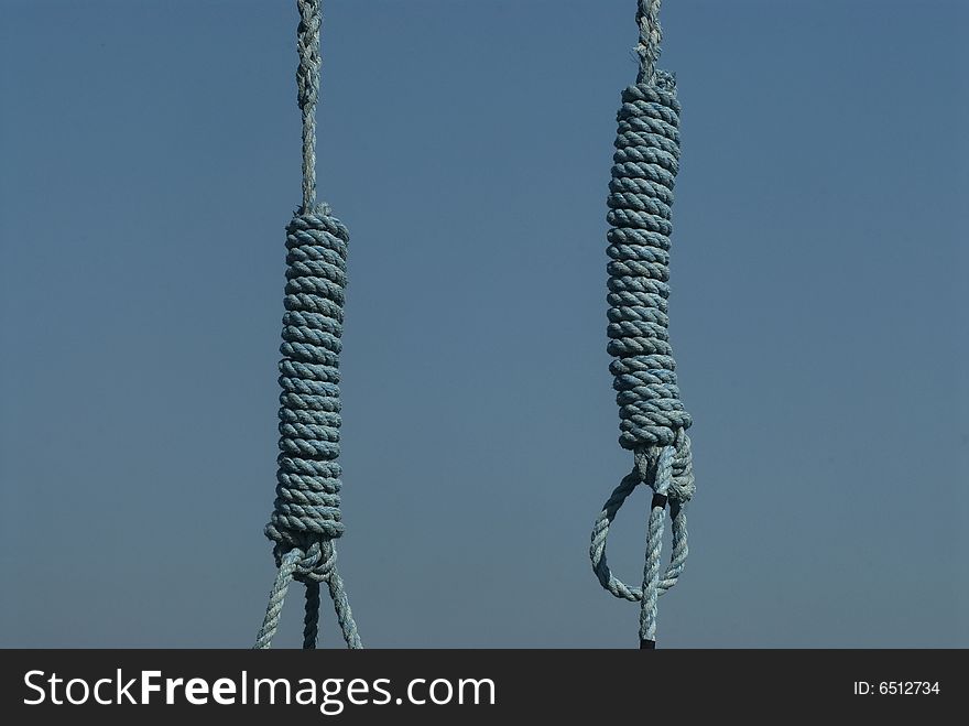 Blue rope hanging on a blue background