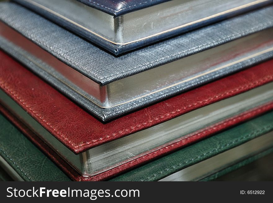 Stack of various organizers in a hard cover