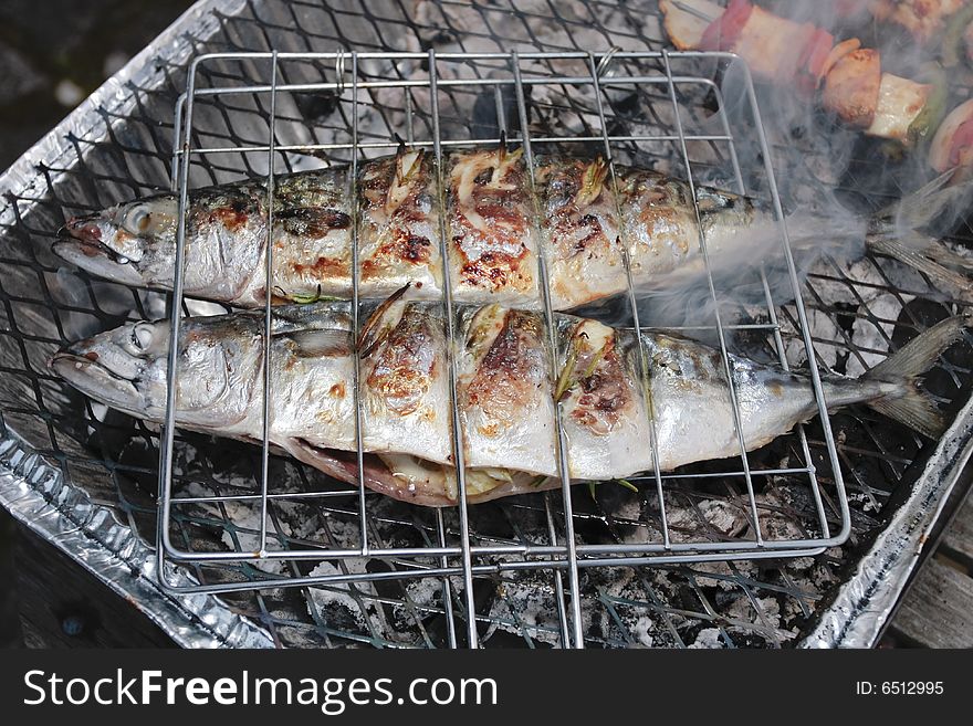 Barbecue grill with  fresh stuffed fish. Barbecue grill with  fresh stuffed fish