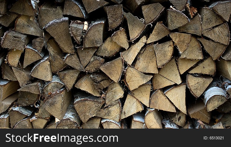 Woodpile.Birch fire wood combined in a stack