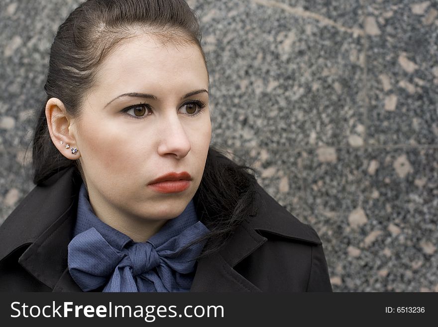 Outdoor portrait of attractive brunet woman