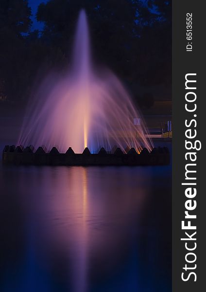 Water fountain illuminated during nightly operation. Water fountain illuminated during nightly operation.