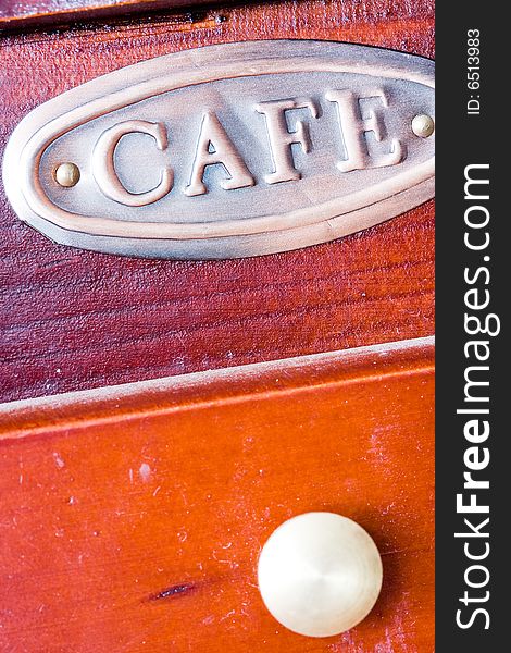 A coffee-mill on a table. A coffee-mill on a table