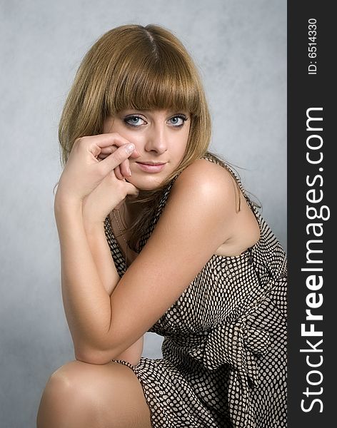 Stylish girl in a brown dress