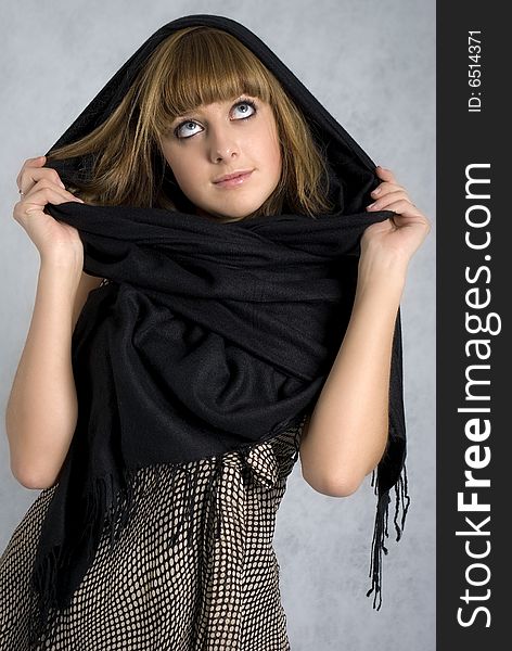 Pensive girl in a black shawl