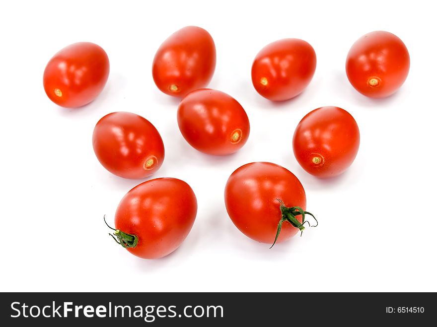 many tomatoes on the vine .