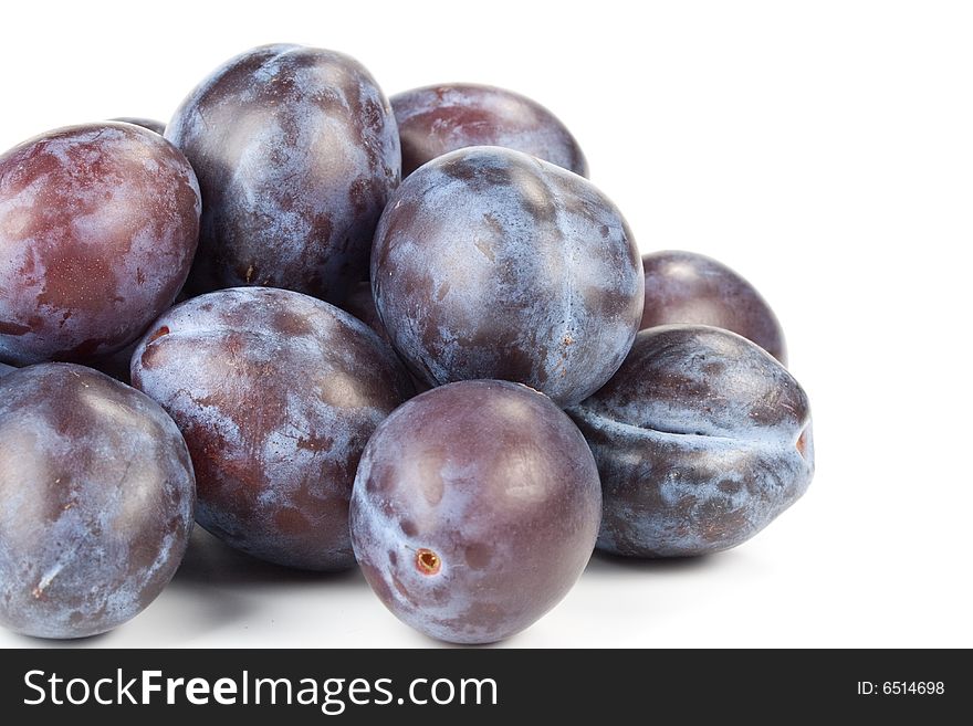 Fresh appetizing plums on a white background. Fresh appetizing plums on a white background