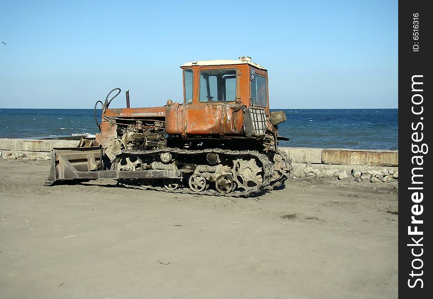 Bulldozer placed on the embankment with high detailed caterpillar. Bulldozer placed on the embankment with high detailed caterpillar