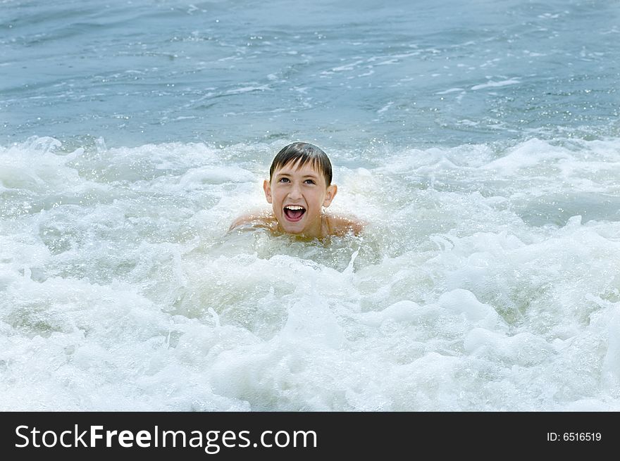 A shot of boy in sea. A shot of boy in sea