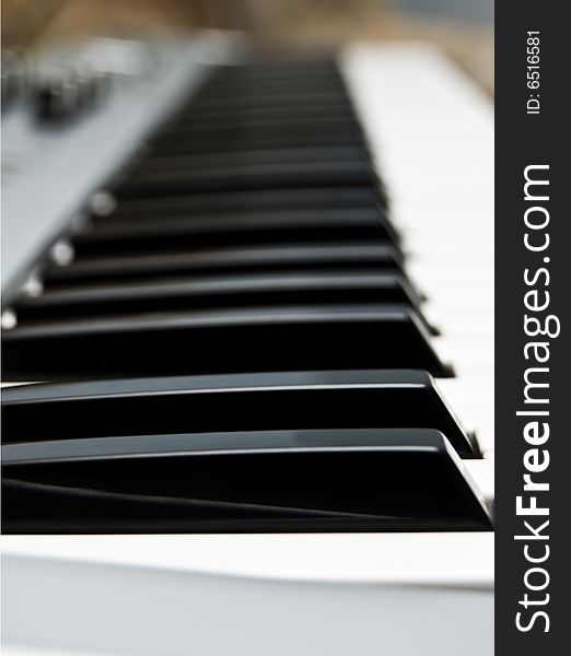 Keys of piano by a large plan