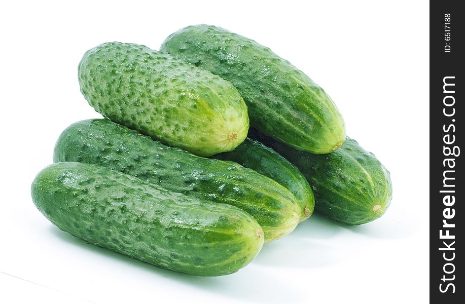 Bunch of green cucumbers on white background