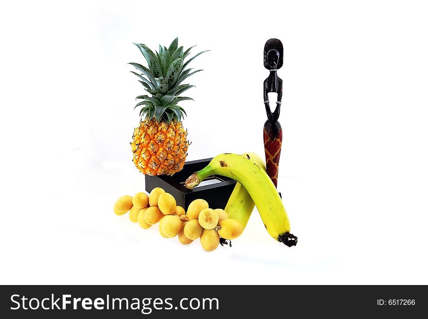 Arrangement from tropical fruit and figures