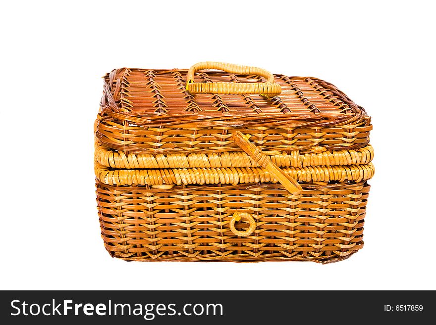 Yellow wicker basket isolated on the white background