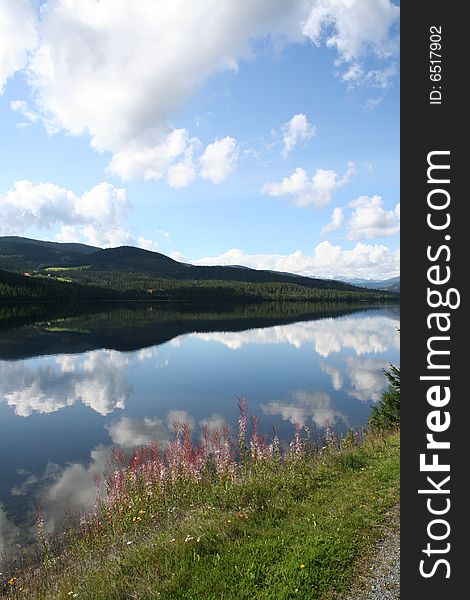 A mountain image from Norway. The reflection in a lake. A mountain image from Norway. The reflection in a lake