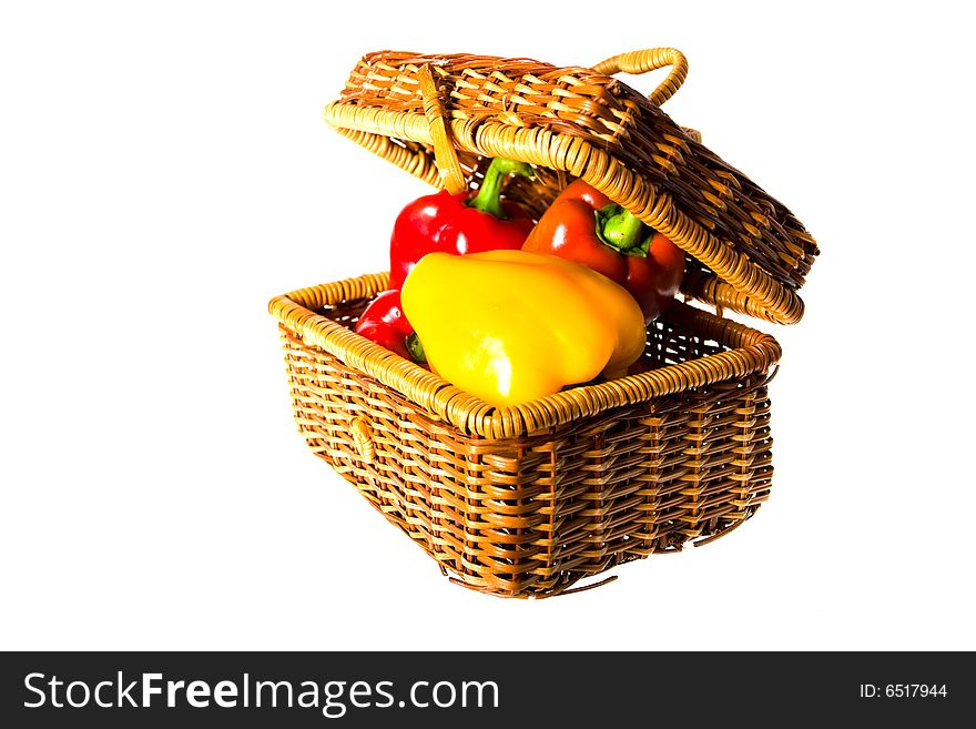 Paprika in the basket isolated on the white background
