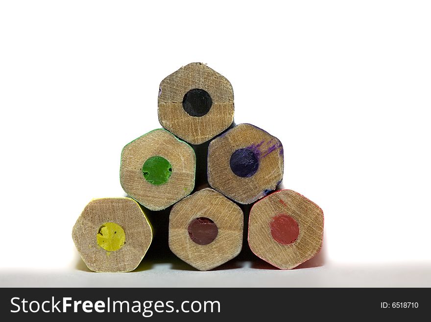 Stack of colored hexagon shaped pencils macro with copy-space concept. Stack of colored hexagon shaped pencils macro with copy-space concept