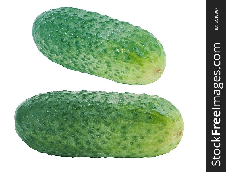 Fresh green cucumbers on white background