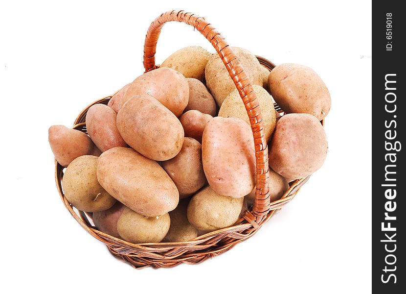 Potatoes in a basket isolated on white