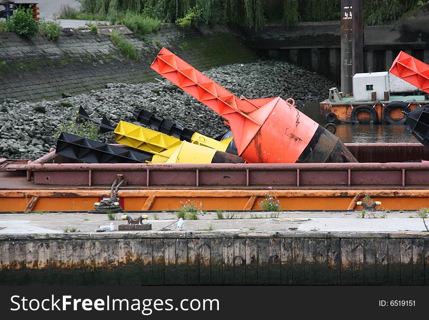 Coloured buoys lying on a ship in port