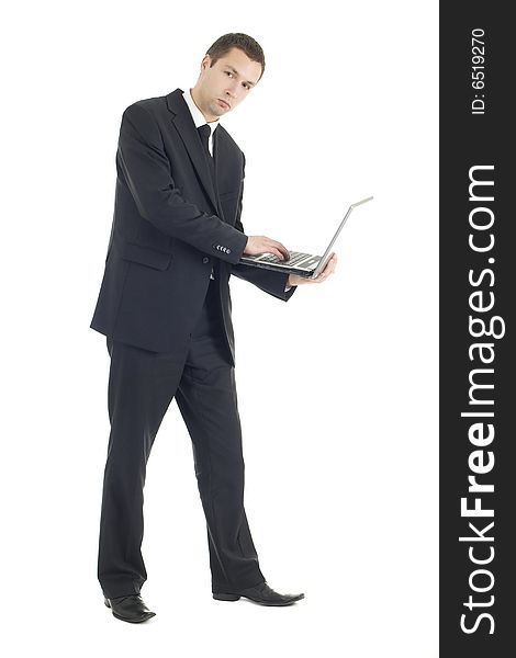 Young businessman with notebook on white background
