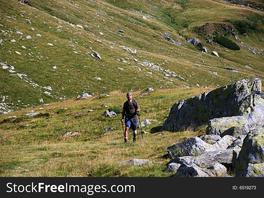 A solitary hiker walking on the mountains