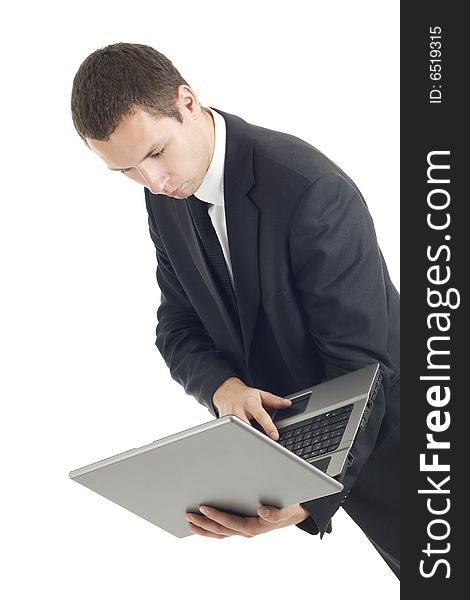 Young businessman with notebook on white background