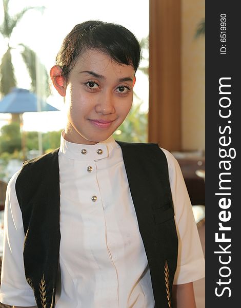 Beautiful Waiter at restaurant smiling. Beautiful Waiter at restaurant smiling