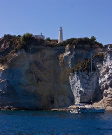 Lighthouse On Steep Mountain And Sail Yacht Stock Images Lighthouse On Steep Mountain And Sail Yacht Stock Images
